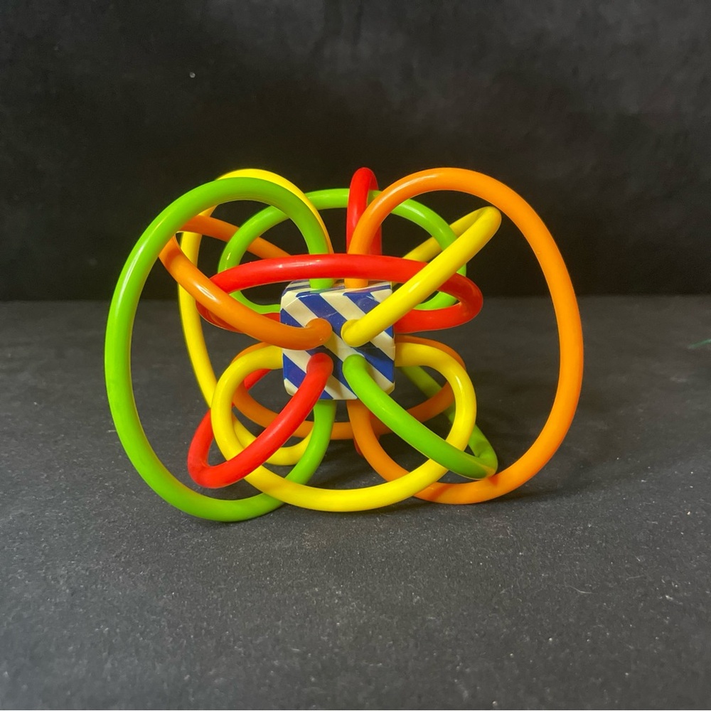 Rare Color Burst Variant of Winkle Rattle by Manhattan toys